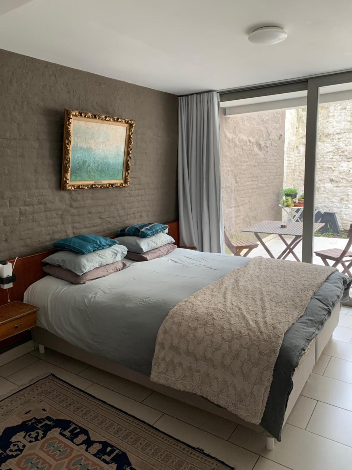 Lounge In The Intimate Urban Garden At A Retro Getaway *