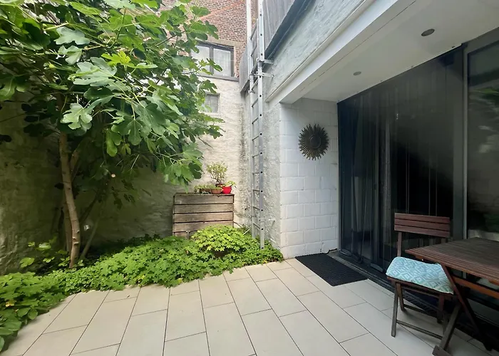 Lounge In The Intimate Urban Garden At A Retro Getaway